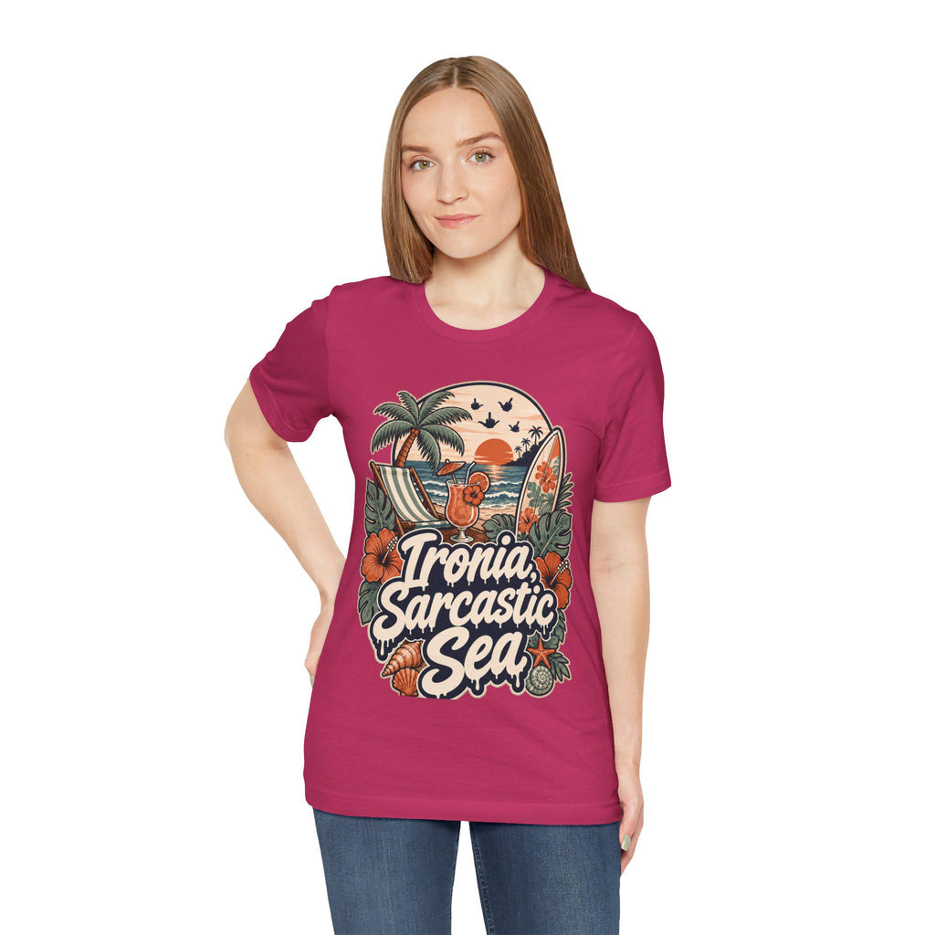 Woman wearing the "Ironia, Sarcastic Sea" retro beach T-shirt by SarcasmArt in raspberry pink.