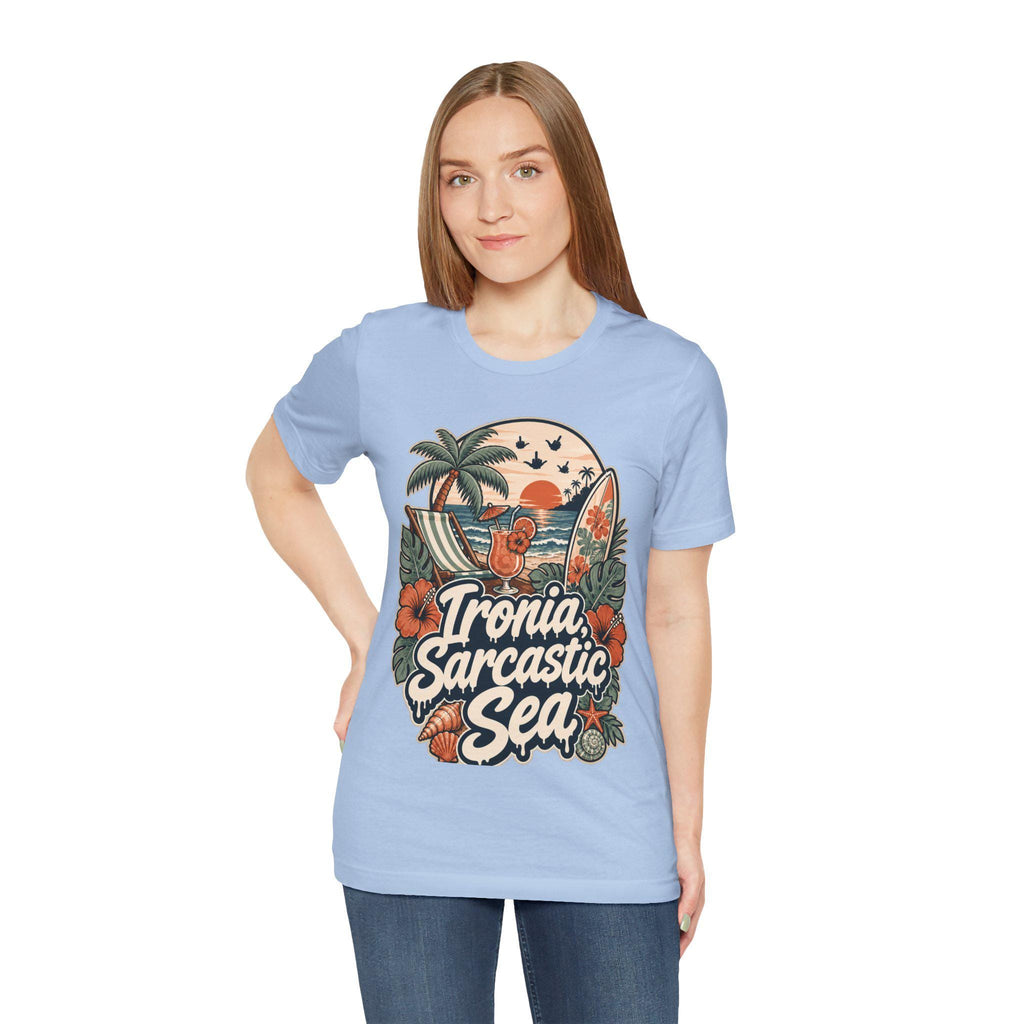 Woman wearing the "Ironia, Sarcastic Sea" retro beach T-shirt by SarcasmArt in light blue.