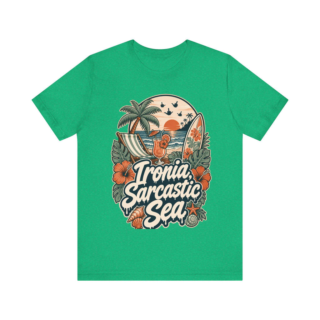 "Ironia, Sarcastic Sea" retro beach T-shirt by SarcasmArt in kelly green on a plain background, showing a vintage tropical beach scene with palm tree, deck chair, cocktail, surfboard, sunset, hibiscus flowers and shells around the script Ironia, Sarcastic Sea.
