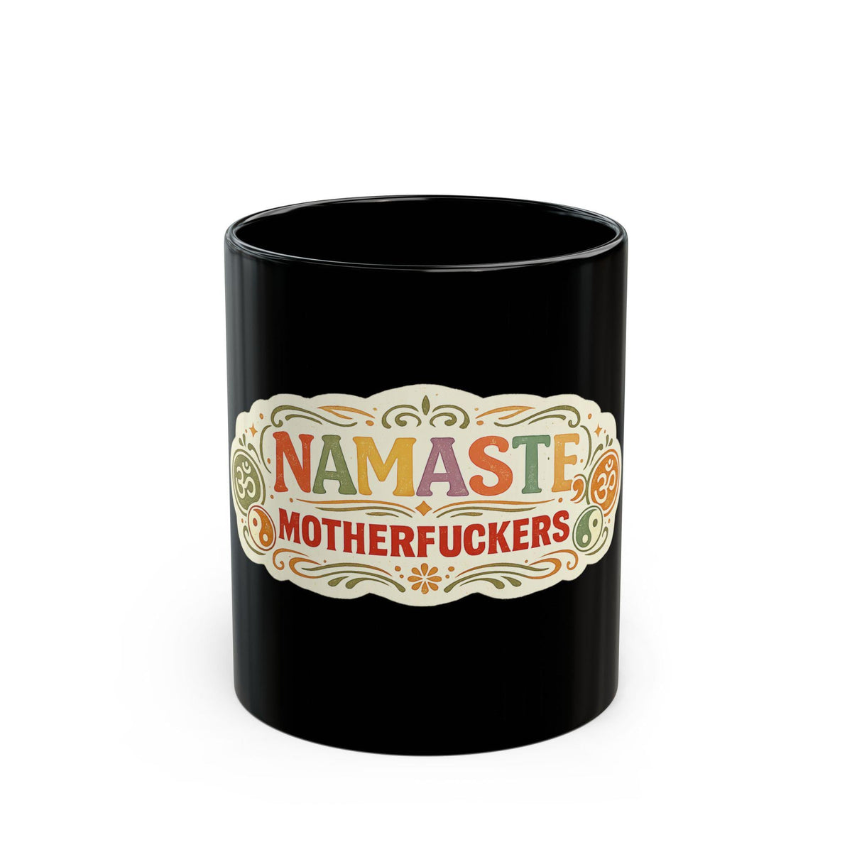 The black "Namaste Motherfuckers" funny yoga coffee mug by SarcasmArt on a white background, showing a colorful boho mandala label with the adult-humor phrase NAMASTE MOTHERFUCKERS in red, orange and teal.