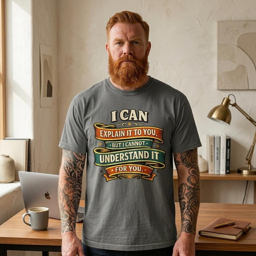 Bearded man in a home office wearing the "I Can Explain It to You, But I Can't Understand It for You" sarcastic teacher T-shirt by SarcasmArt in Pepper.