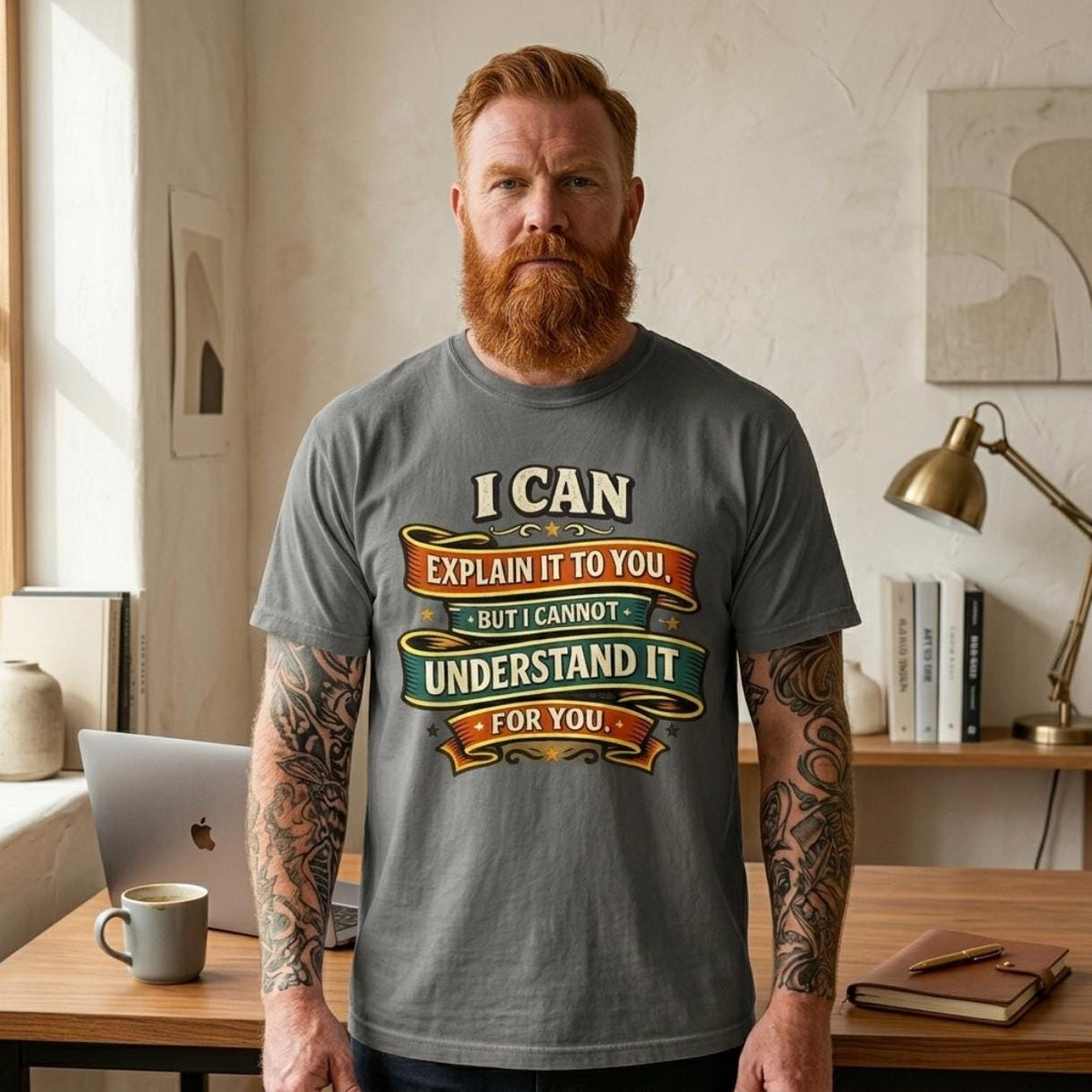 Bearded man in a home office wearing the "I Can Explain It to You, But I Can't Understand It for You" sarcastic teacher T-shirt by SarcasmArt in Pepper.