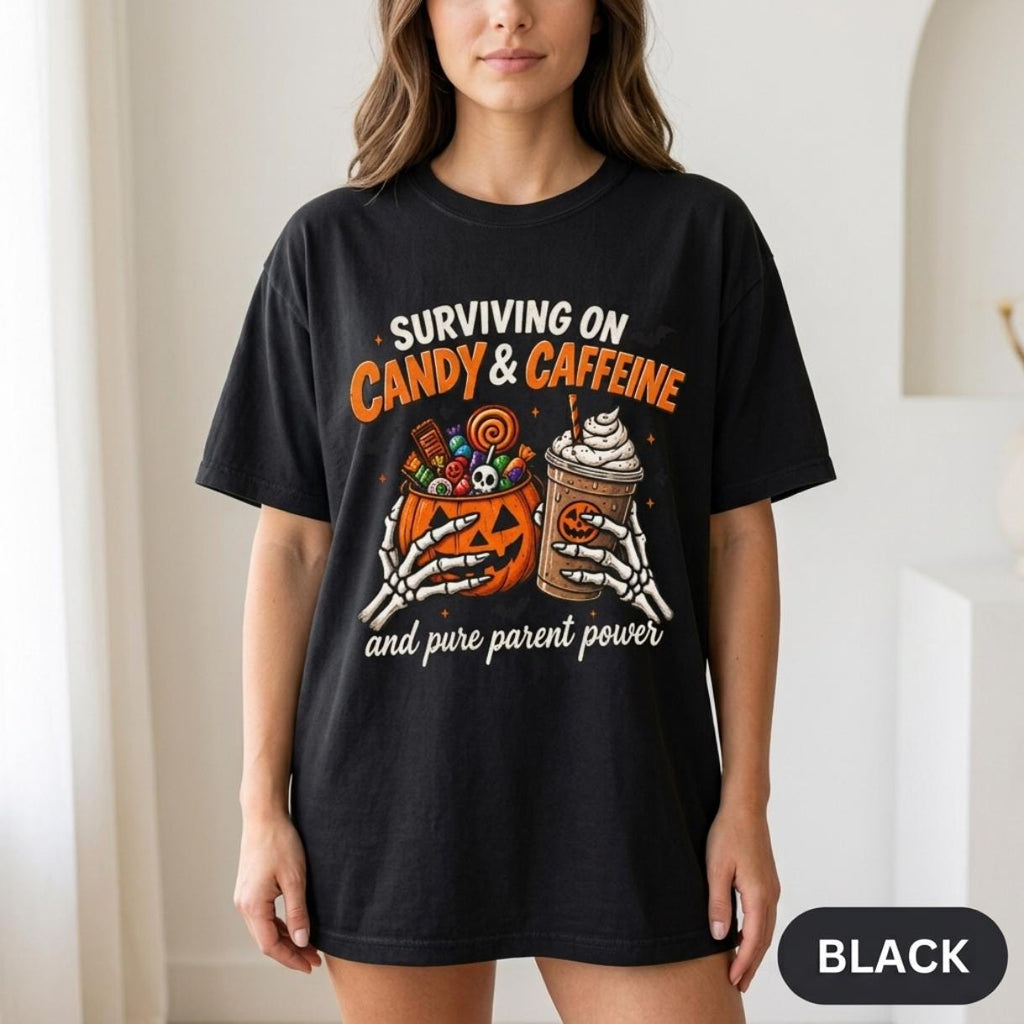 Woman wearing the "Surviving on Candy & Caffeine" Halloween mom T-shirt by SarcasmArt in Black.