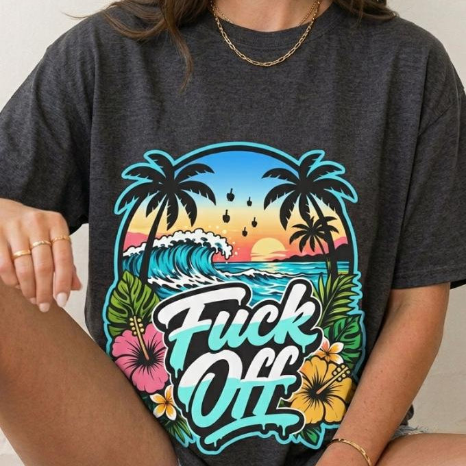 Woman sitting wearing the "F*ck Off" retro tropical beach T-shirt by SarcasmArt in Dark Grey Heather – a Bella+Canvas 3001 unisex tee with a retro sunset beach scene with palm trees and hibiscus flowers behind bold white script lettering reading Fuck Off.