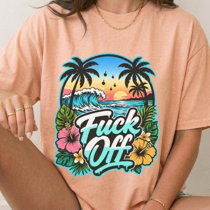 Woman sitting wearing the "F*ck Off" retro tropical beach T-shirt by SarcasmArt in Heather Peach.