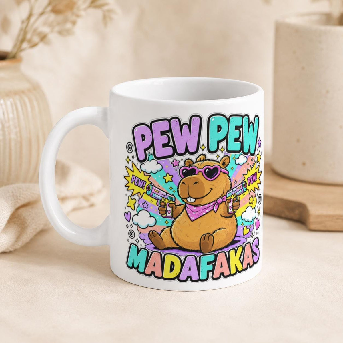 The "Pew Pew Madafakas" capybara coffee mug by SarcasmArt on a kitchen counter, showing the capybara with laser guns.