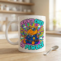 "Depewty Chief of Pewlice" capybara coffee mug by SarcasmArt: white 11 oz glossy ceramic mug with a capybara police officer in sunglasses and a blue uniform with colorful comic bursts and DEPEWTY CHIEF OF PEWLICE lettering, on a kitchen counter.