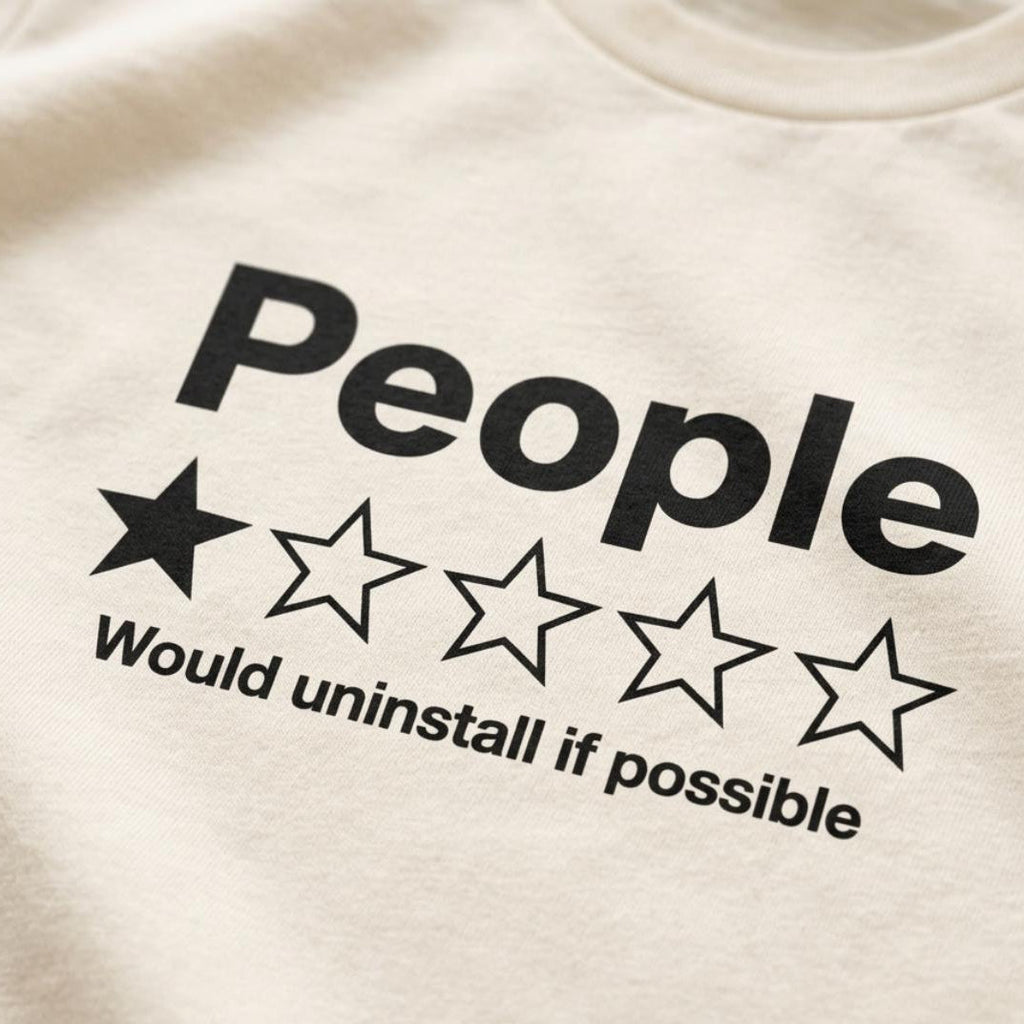 Close-up of the one-star People review print on the Natural "People – 1 Star, Would Uninstall If Possible" funny review T-shirt by SarcasmArt.