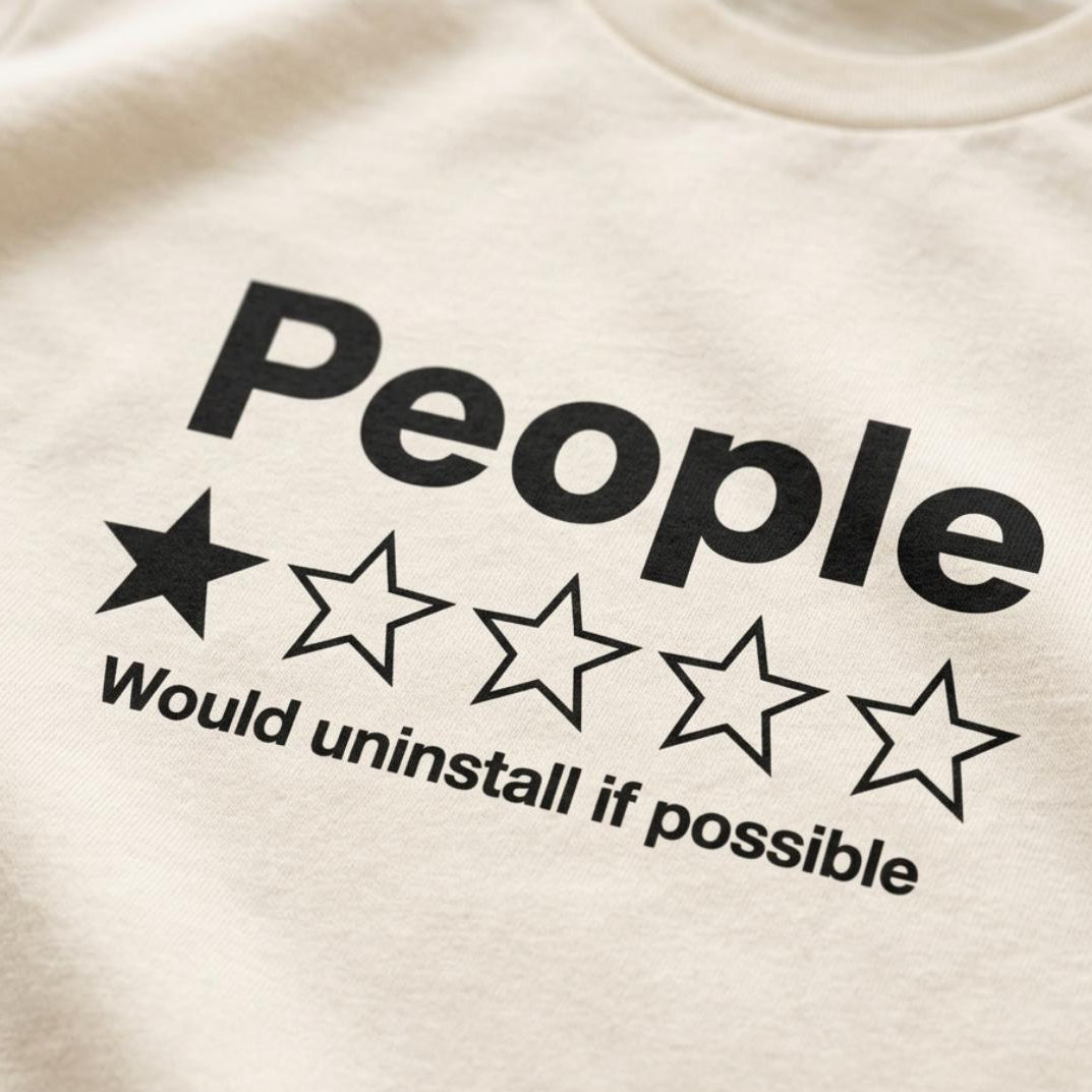 Close-up of the one-star People review print on the Natural "People – 1 Star, Would Uninstall If Possible" funny review T-shirt by SarcasmArt.