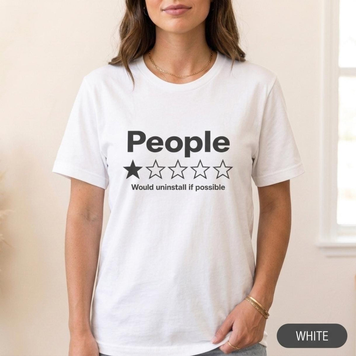 Woman wearing the "People – 1 Star, Would Uninstall If Possible" funny review T-shirt by SarcasmArt in White, a minimalist sarcastic introvert shirt.