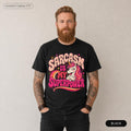 Bearded man wearing the "Sarcasm Is My Superpower" unicorn T-shirt by SarcasmArt in Black.