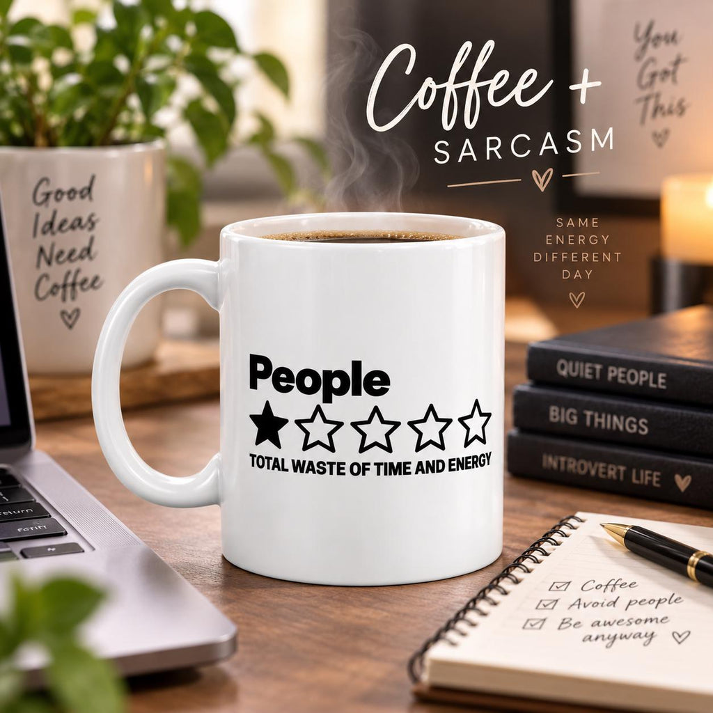 Coffee and sarcasm: the "People – 1 Star, Total Waste of Time and Energy" sarcastic coffee mug by SarcasmArt filled with coffee on a desk with books and a notebook.