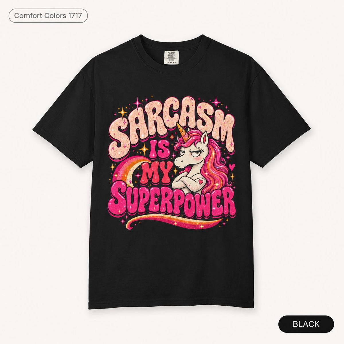 Black "Sarcasm Is My Superpower" unicorn T-shirt by SarcasmArt: Comfort Colors 1717 unisex tee with an eye-rolling retro unicorn with a pink mane over a rainbow and bold pink and cream lettering SARCASM IS MY SUPERPOWER.