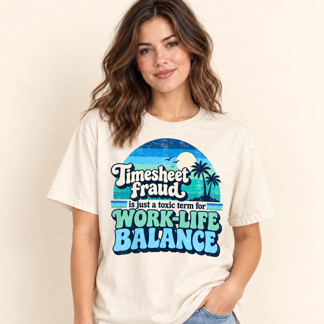 Smiling woman in jeans wearing the "Timesheet Fraud Is Just a Toxic Term for Work-Life Balance" sarcastic work T-shirt by SarcasmArt in Ivory – a funny office humor gift for coworkers.