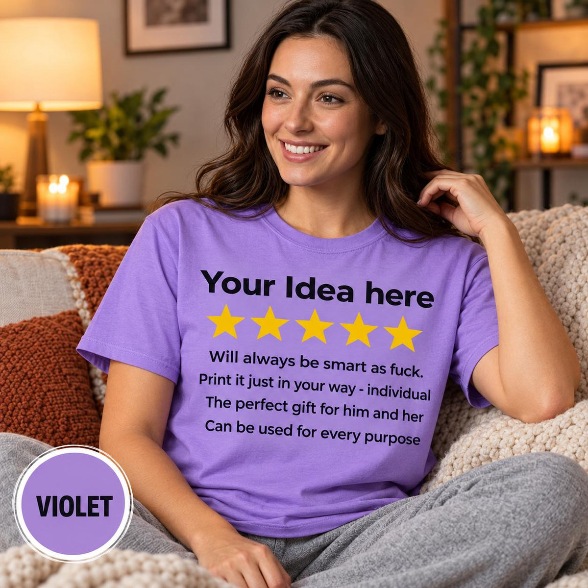 Smiling woman on a cozy sofa wearing the personalized golden 5-star review T-shirt for light colors by SarcasmArt in Violet.