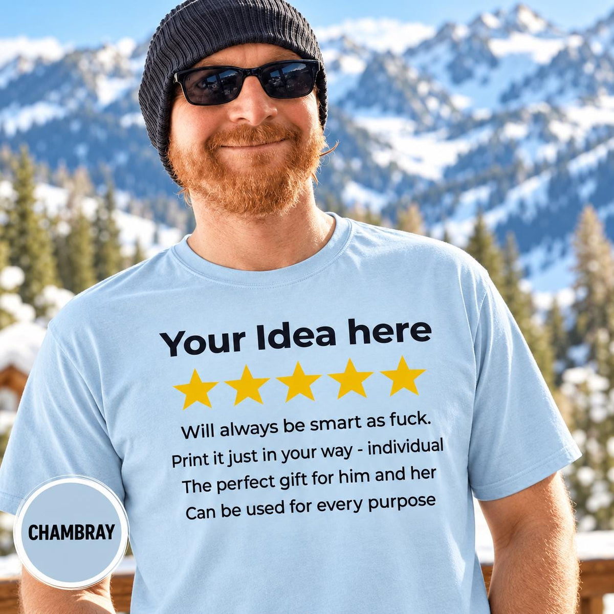 Bearded man in a beanie and sunglasses in front of snowy mountains wearing the personalized golden 5-star review T-shirt for light colors by SarcasmArt in Chambray.