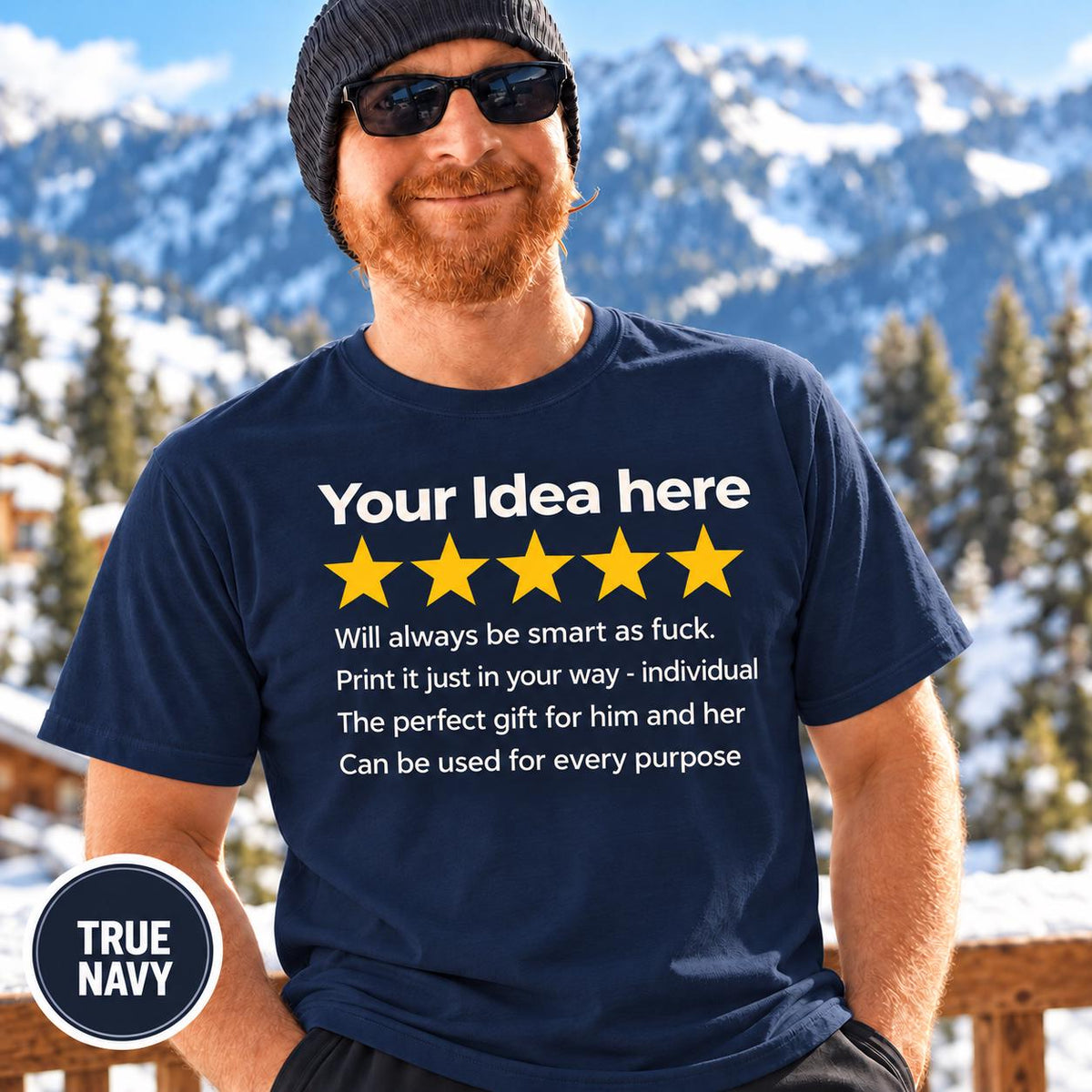 Bearded man in a beanie and sunglasses in front of snowy mountains wearing the personalized golden 5-star review T-shirt by SarcasmArt in True Navy, with your custom title, five golden stars and four lines of your own review text in white.