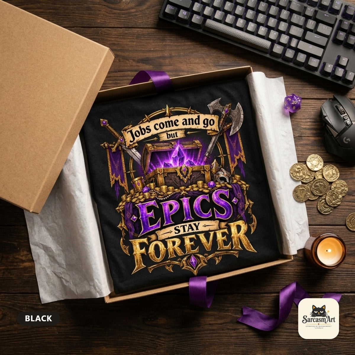 The Black "Epics Stay Forever" funny gamer T-shirt by SarcasmArt folded in an open kraft gift box with tissue paper with a keyboard, gold coins, purple ribbon and a candle – ready to give as a birthday or Christmas gift.