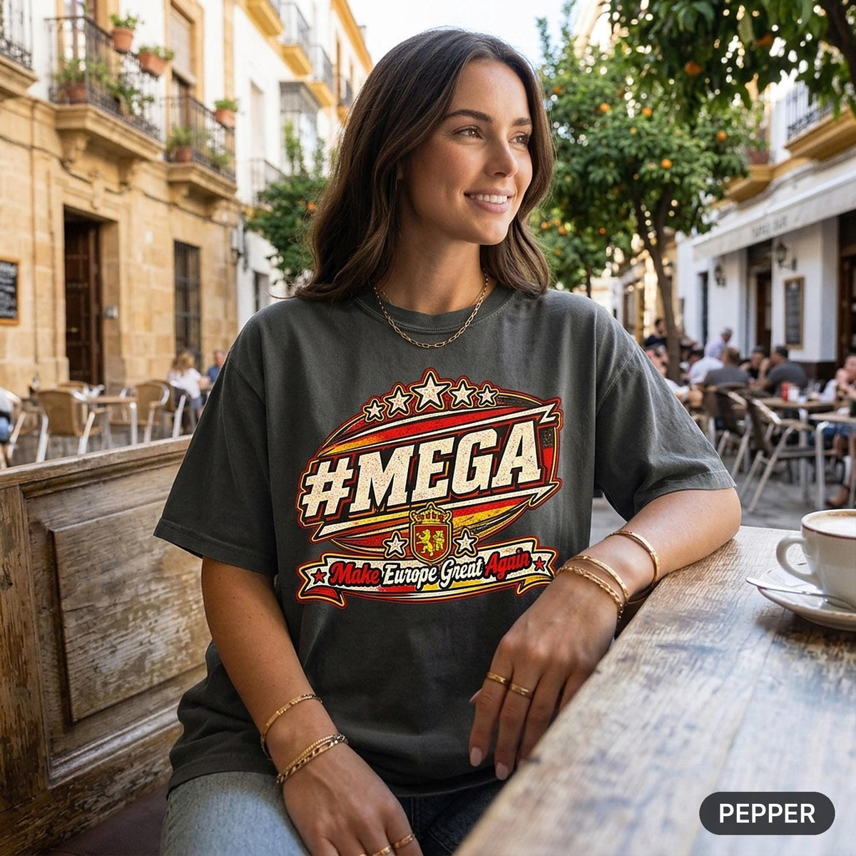 Woman holding a coffee at a café terrace wearing the "#MEGA Make Europe Great Again" Spain T-shirt by SarcasmArt in Pepper.