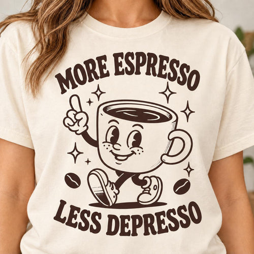Close-up of the "More Espresso, Less Depresso" retro coffee T-shirt by SarcasmArt in Ivory: a smiling vintage cartoon coffee cup mascot giving a peace sign between the words MORE ESPRESSO and LESS DEPRESSO in dark brown, on a Comfort Colors 1717 unisex tee.