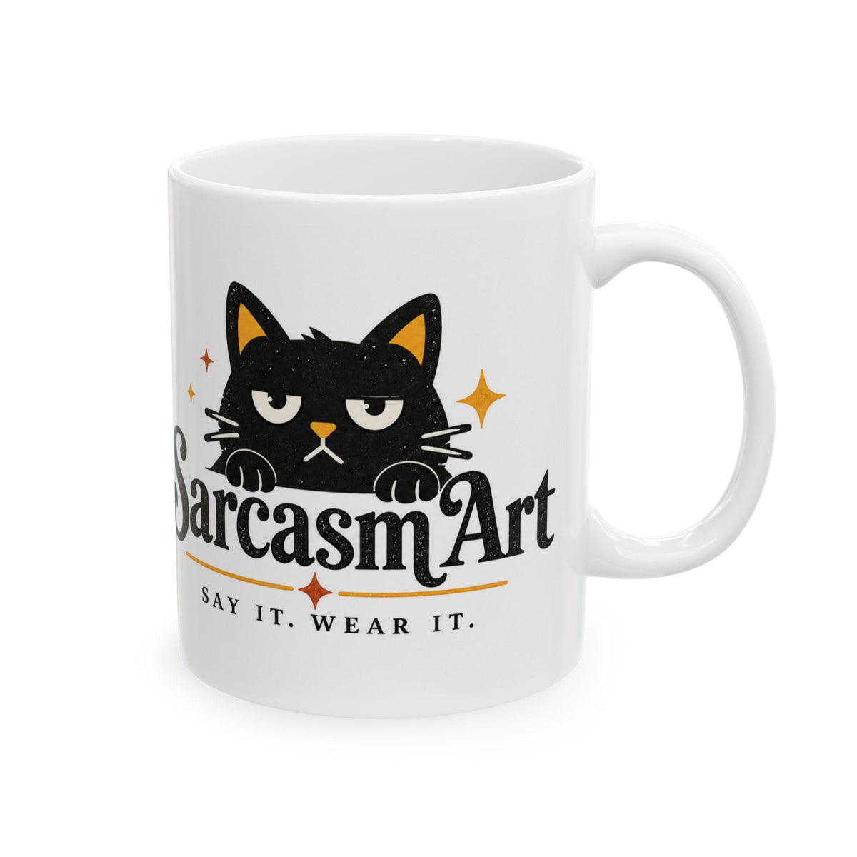 May include: A white ceramic mug featuring a black cat illustration with an annoyed expression. Below the cat, the text reads SarcasmArt in a bold font, followed by the phrase SAY IT. WEAR IT. in smaller capital letters with orange star accents.