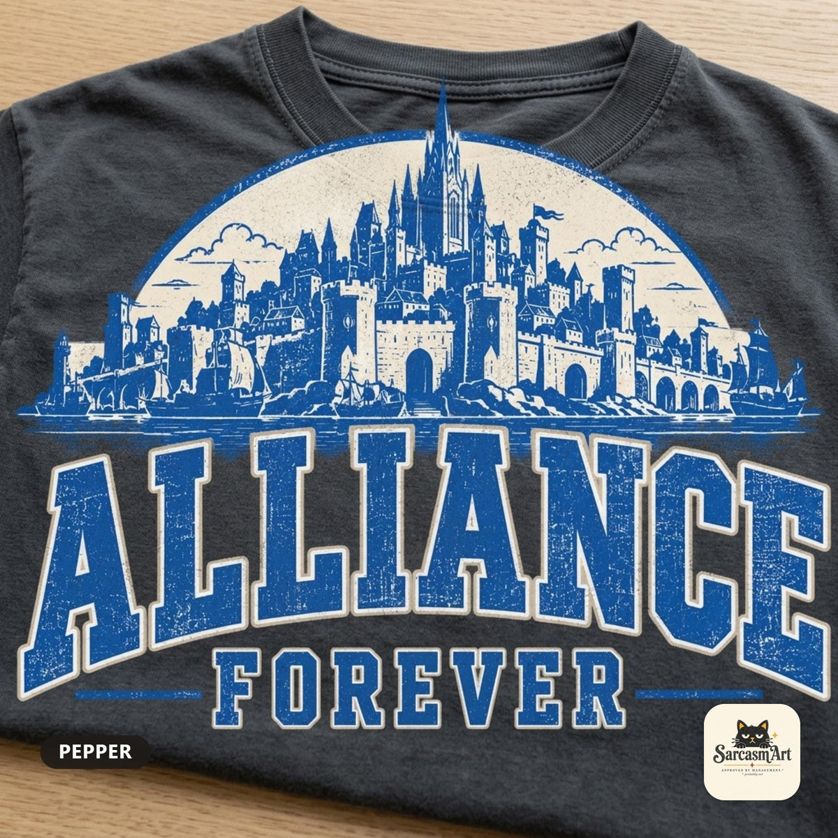 Flat lay of the Pepper "Alliance Forever" World of Warcraft gamer T-shirt by SarcasmArt, showing the full blue distressed ALLIANCE FOREVER varsity lettering under a fantasy city skyline front print.