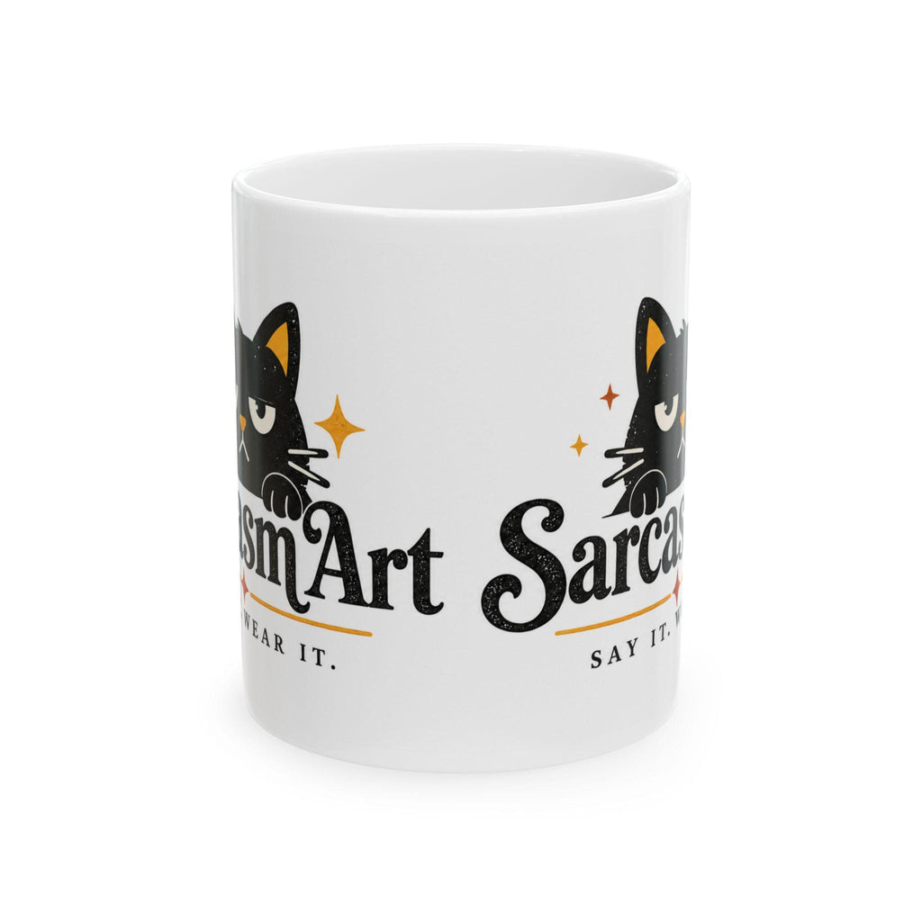 May include: A white ceramic mug featuring a black cat illustration with yellow accents and the text "SarcasmArt" and "SAY IT. WEAR IT." The design includes small orange star icons and a distressed texture on the black lettering.